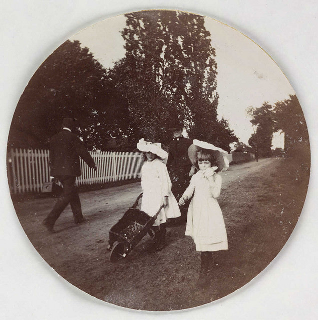 #13 Children walking with a wheelbarrow