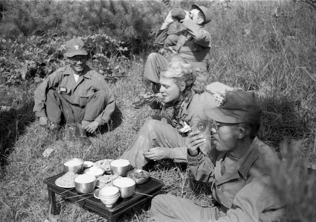 LIFE’s Margaret Bourke-White shares a meal with South Korean troops, 1952.