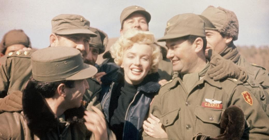 #111 American movie actress Marilyn Monroe entertains a group of soldiers in Korea.