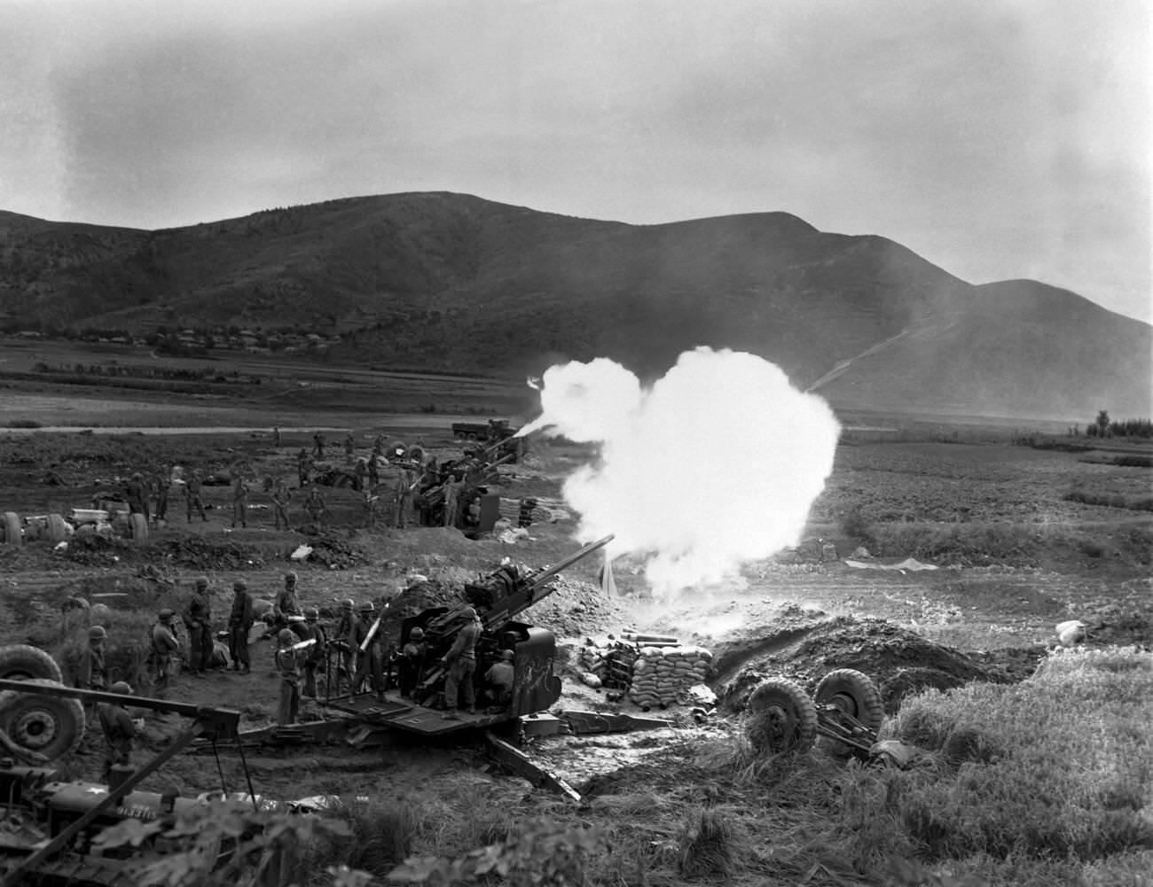 #13 Korean War, Artillery Crew Fires 90MM, 1950s.