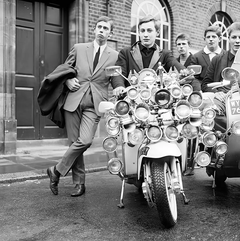 #2 Mods in suits and parkas show off modified scooters in Peckham, England, 1964.
