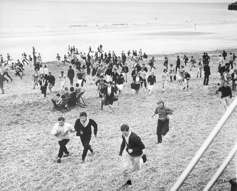 #9 Hundreds of mods and rockers convene on a beach for an all-out brawl in Hastings, England, 1964.