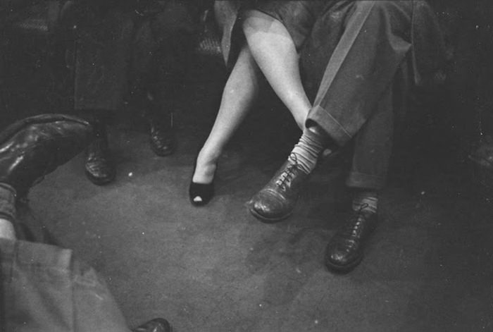 #19 A couple playing footsies on a subway, 1946.