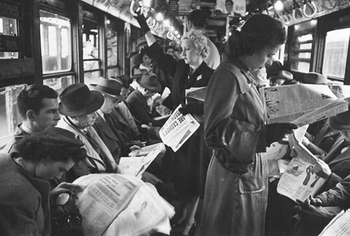 #36 Passengers reading in a subway car, 1946.