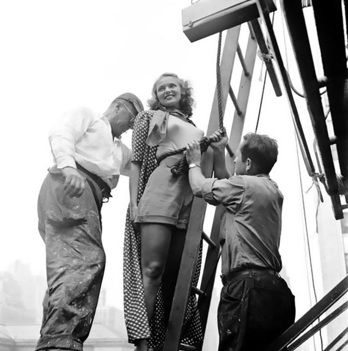 #38 A painter tying rope around the model’s waist, 1947.
