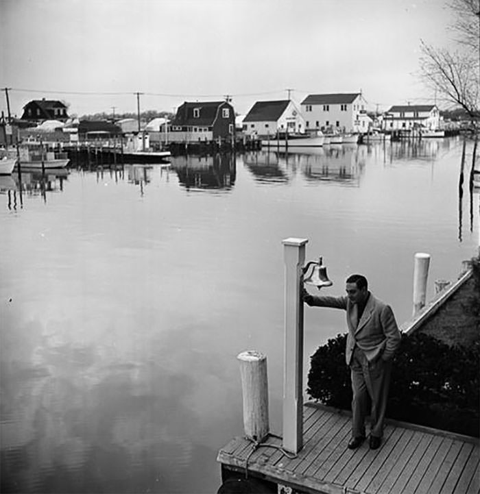 #40 Guy Lombardo on a dock, 1940s.