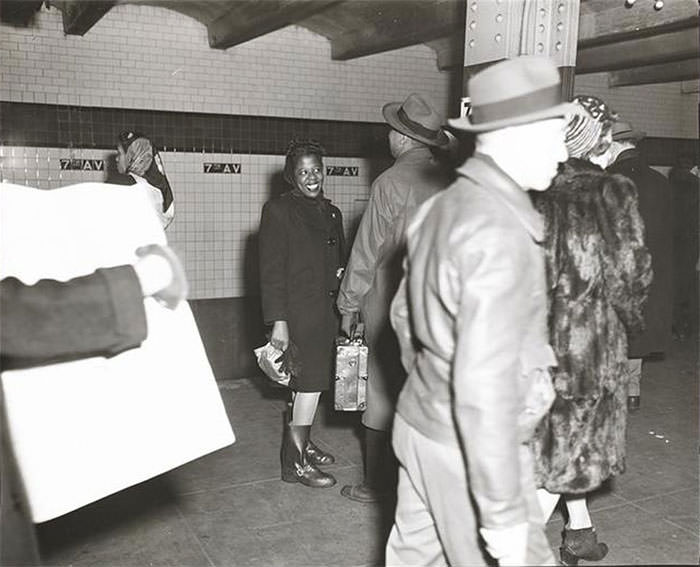 #42 A woman waiting on a subway platform, 1940s.