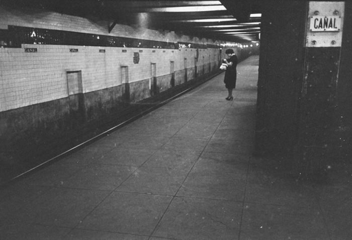 #47 A woman waiting on a subway platform, 1946.