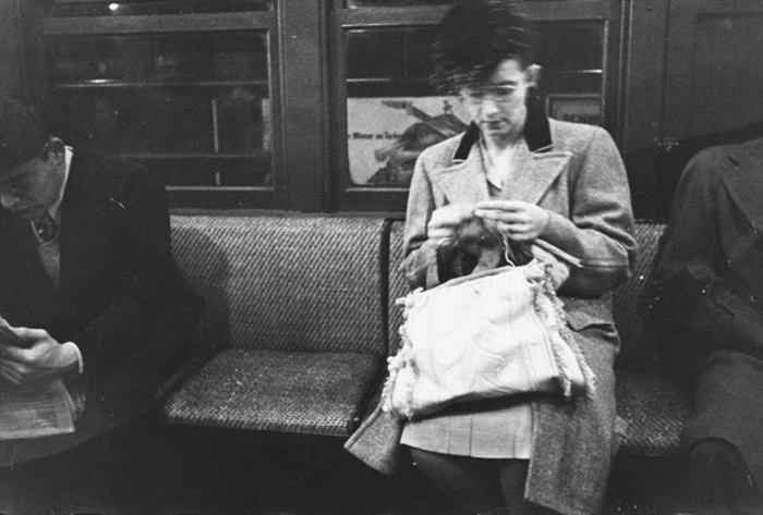 #56 A woman knitting on a subway, 1946.