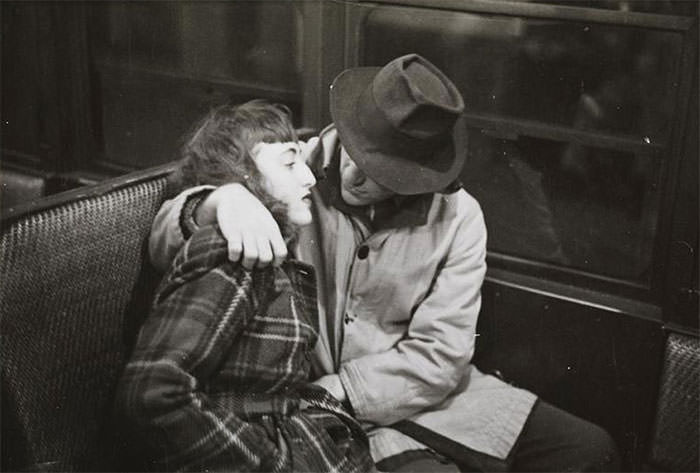 #57 A couple in a subway car, 1940s.