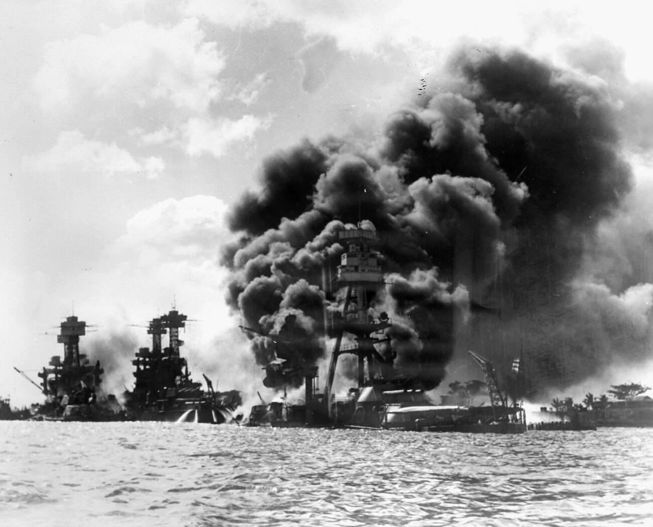#25 Battleships burning in Pearl Harbor on December 7, 1941, Hawaii, USA. L. to R. USS Arizona, USS Tennessee, and USS West Virginia.