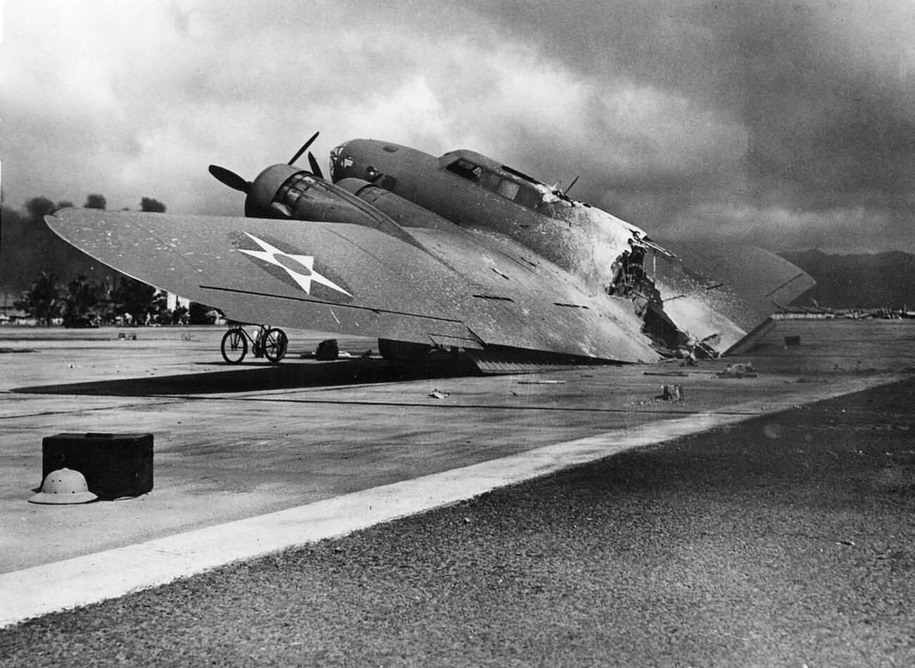 #28 A burned U.S. Army Air Forces Boeing B-17C Flying Fortress at Hickam Field, Pearl Harbor on December 7, 1941.