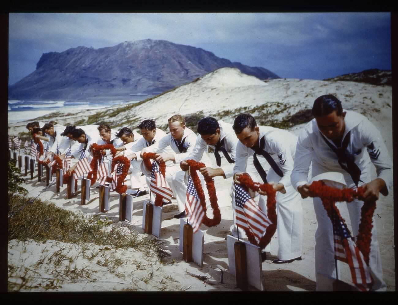 #4 Sailors pay tribute to casualties of the Pearl Harbor attack at a Hawaiian Islands cemetery, 1942.