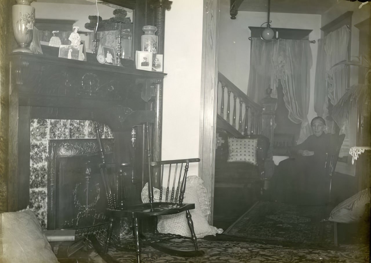 #26 Woman seated in rocking chair