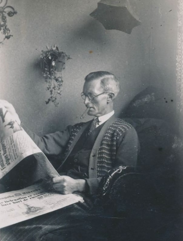 #17 Old Danish man reading the paper and smoking a cigar