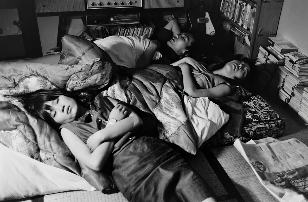 #17 Yoko often ends her long nights sprawled on a futon in a friend’s room, 1964.