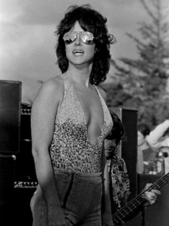 #15 Grace Slick is wearing pants over her bathing suit, 1970