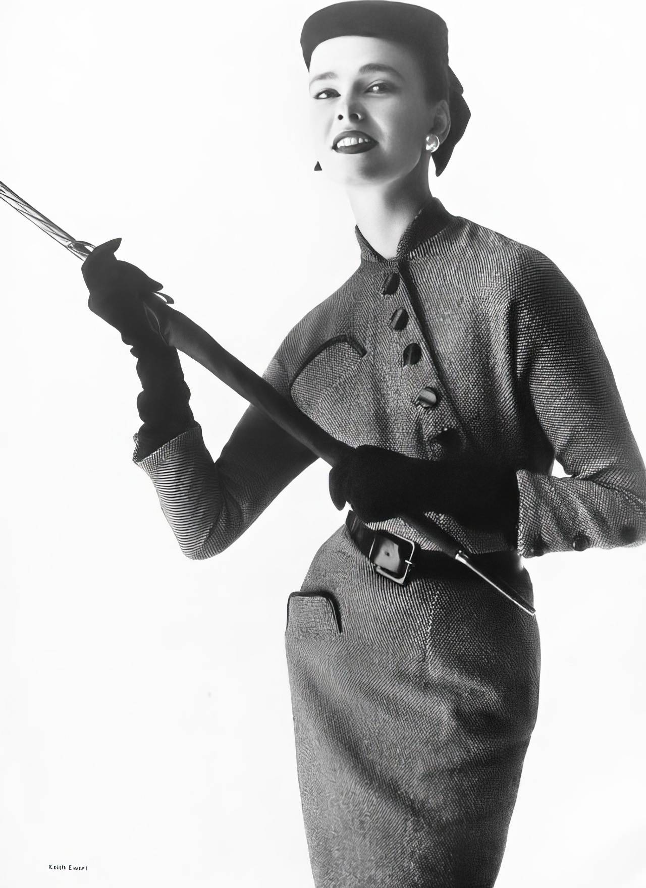 #19 Susan Abraham in a black-and-white tweed dress, 1953.