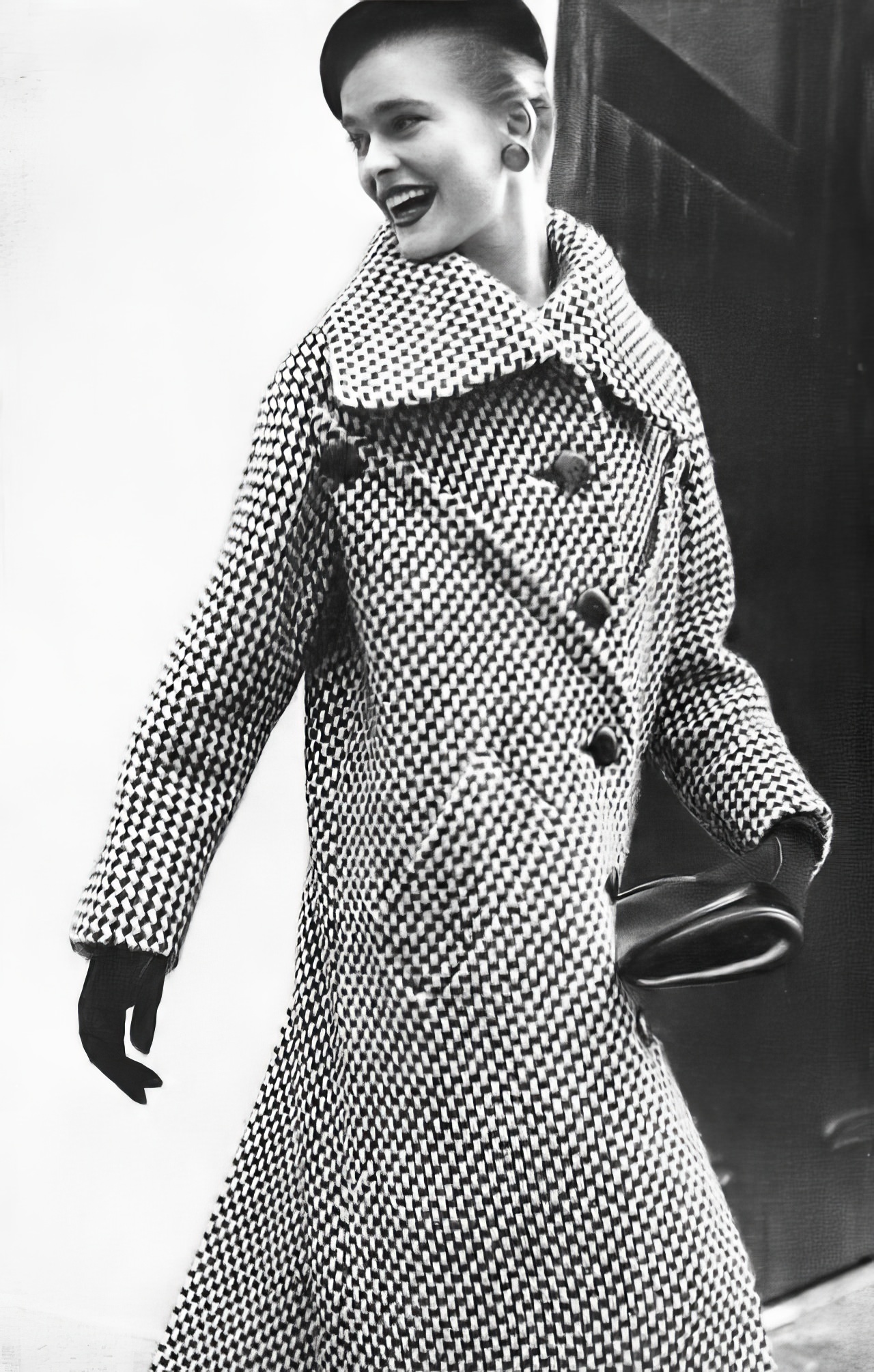 #20 Susan Abraham in a bold black and white basket-tweed coat, 1953.