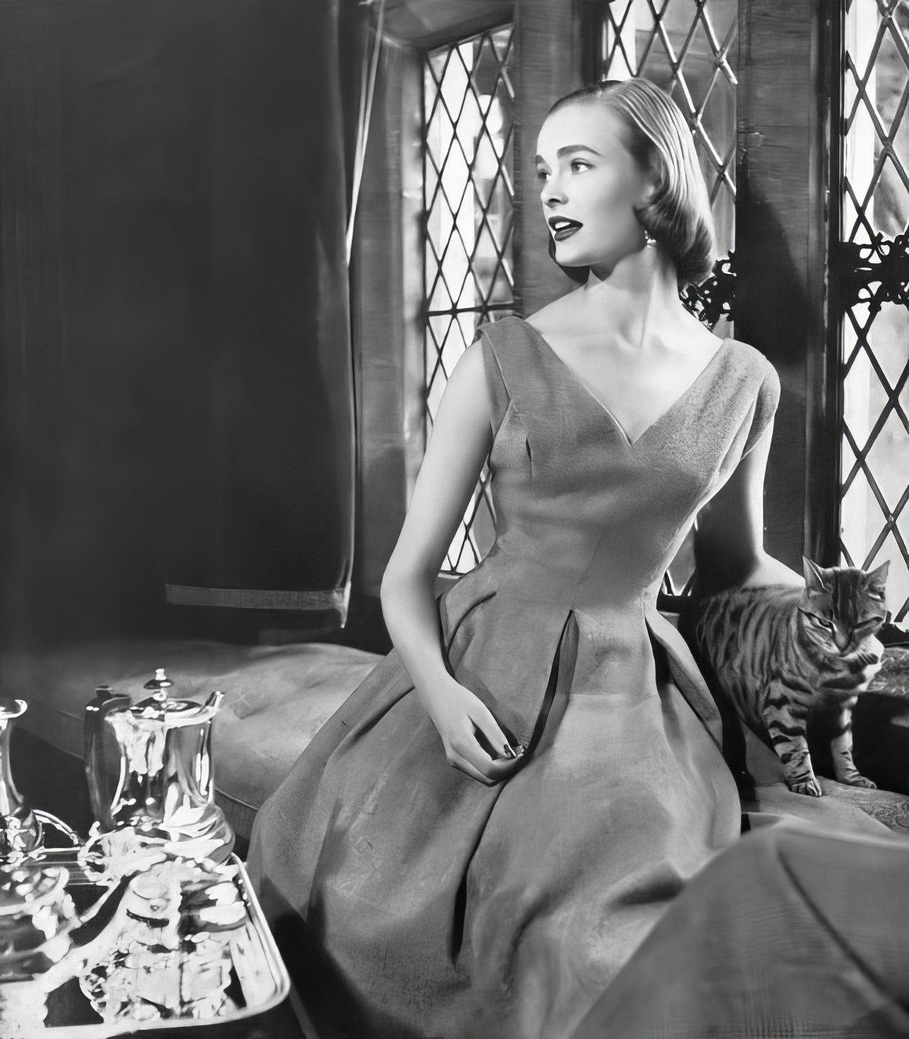 #24 Susan Abraham in a lime-green tweed dress, 1953.