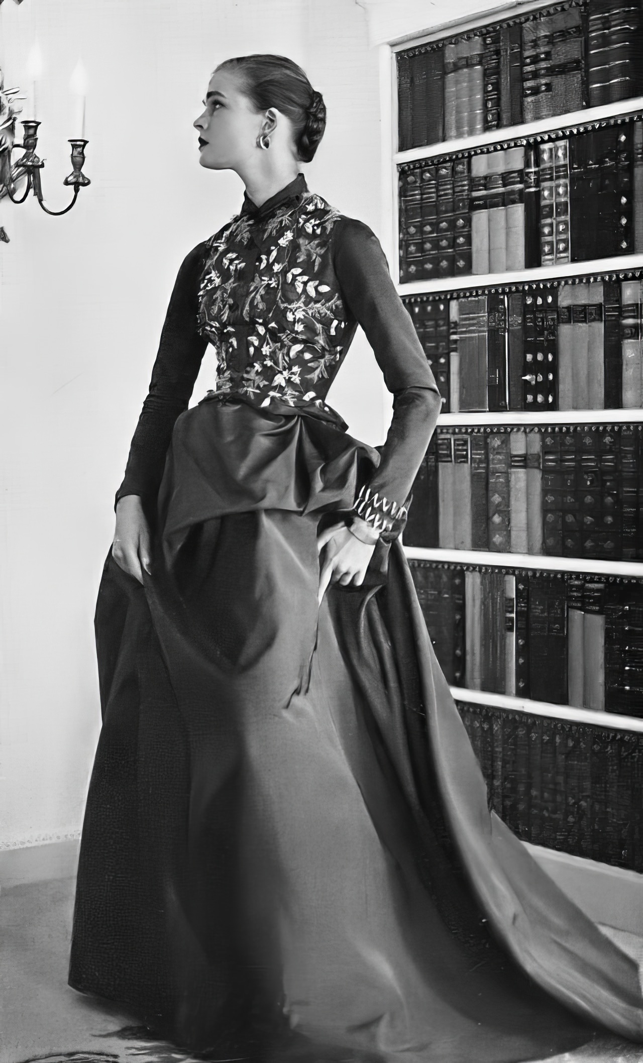 #25 Susan Abraham in a mole-brown backswept faille gown, 1953.