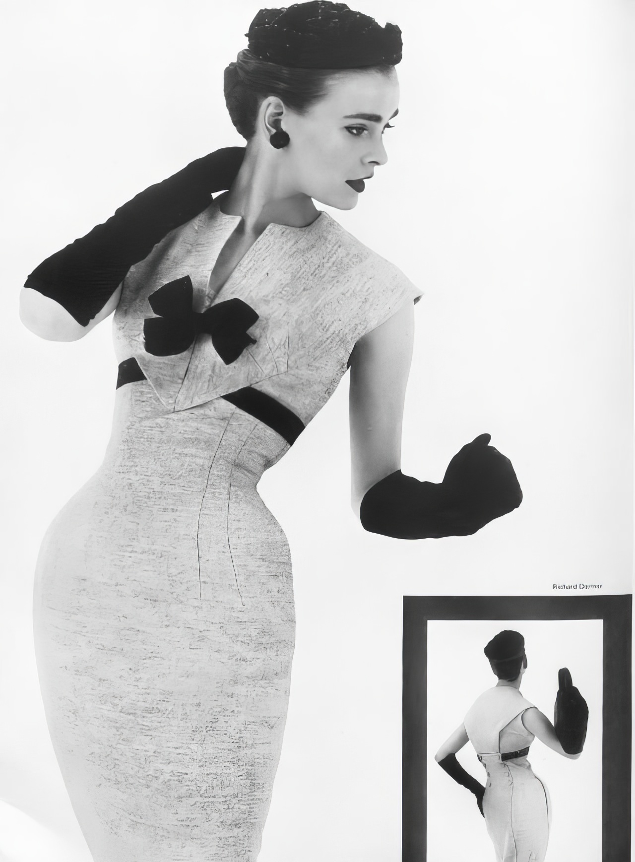 #26 Susan Abraham in an off-white tweed dress, 1953.