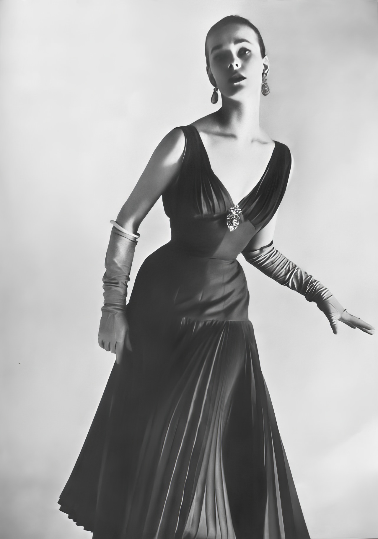 #27 Susan Abraham in a raspberry silk and mohair dress, 1953.