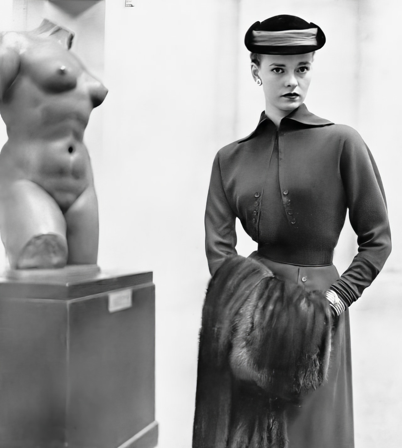 #2 Susan Abraham in a bottle-green wool dress with a bolero-like bodice, 1951.