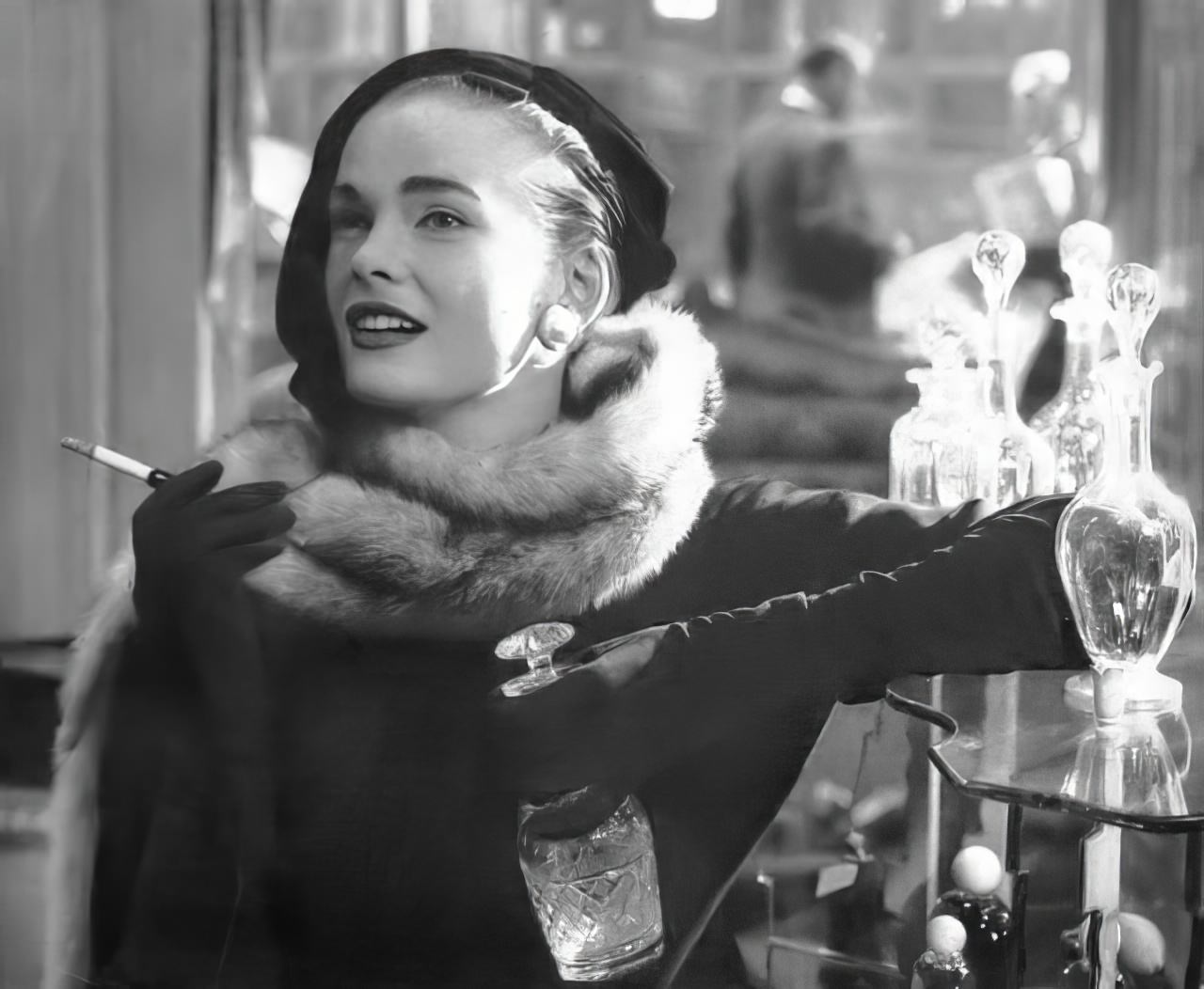 #32 Susan Abraham wearing a black ribbed velvet painter’s beret, 1954.