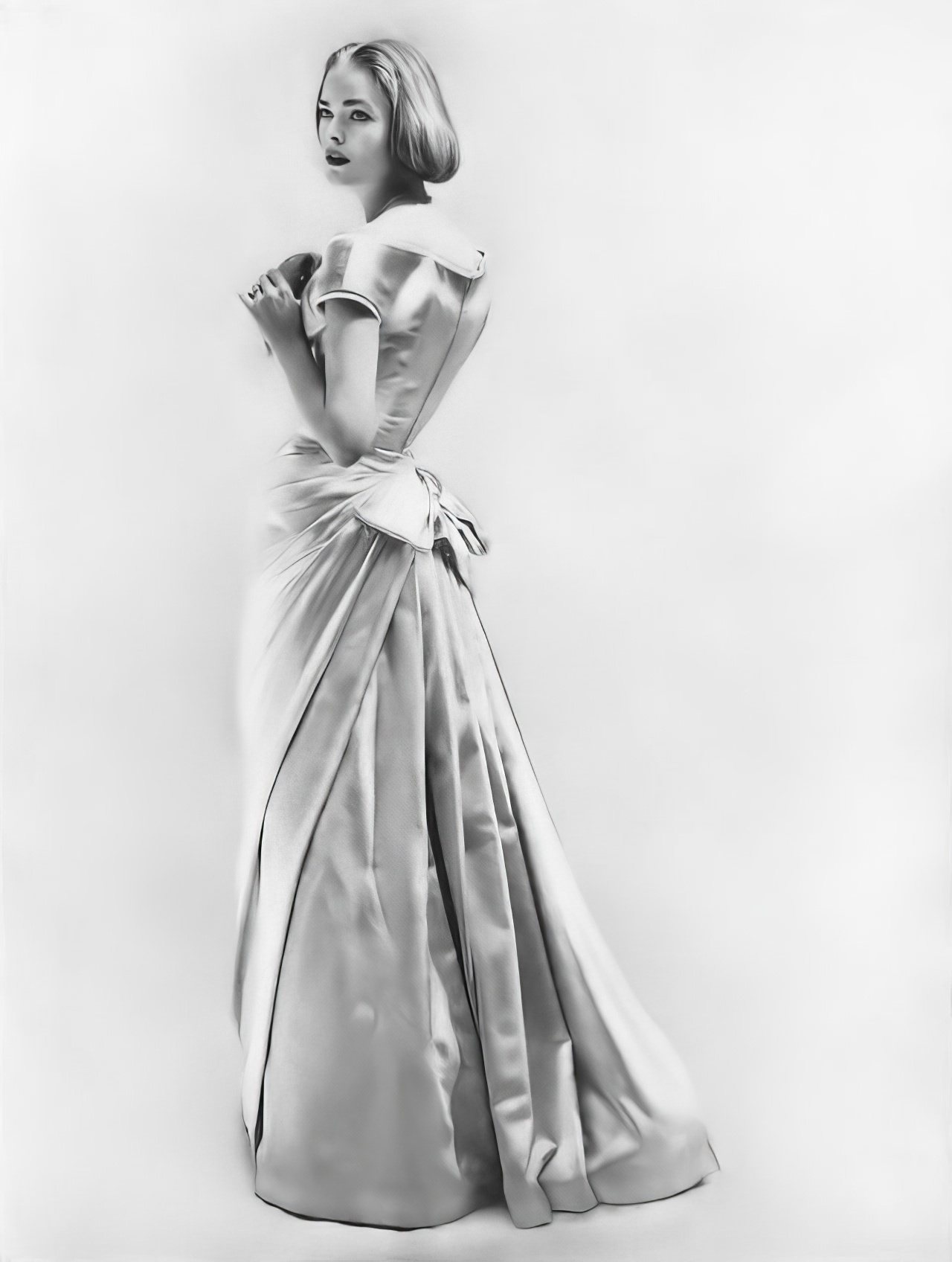 #34 Susan Abraham in an evening dress of eglantine satin, 1956.