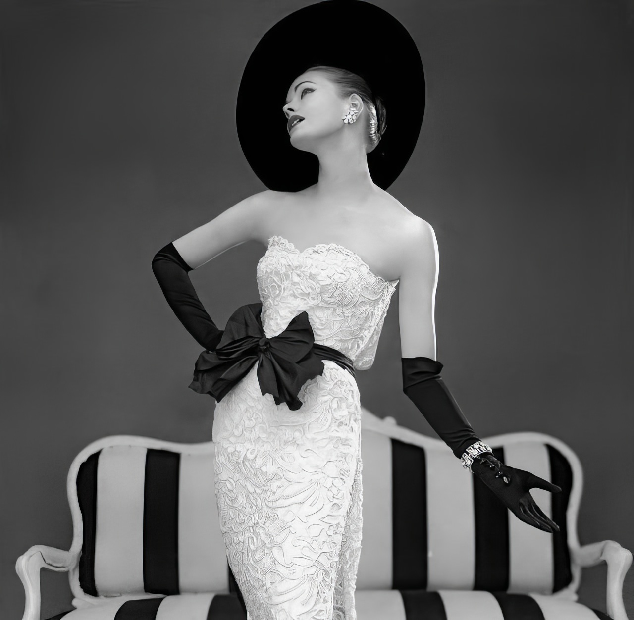 #37 Susan Abraham in John Cavanagh’s strapless evening gown, 1957.