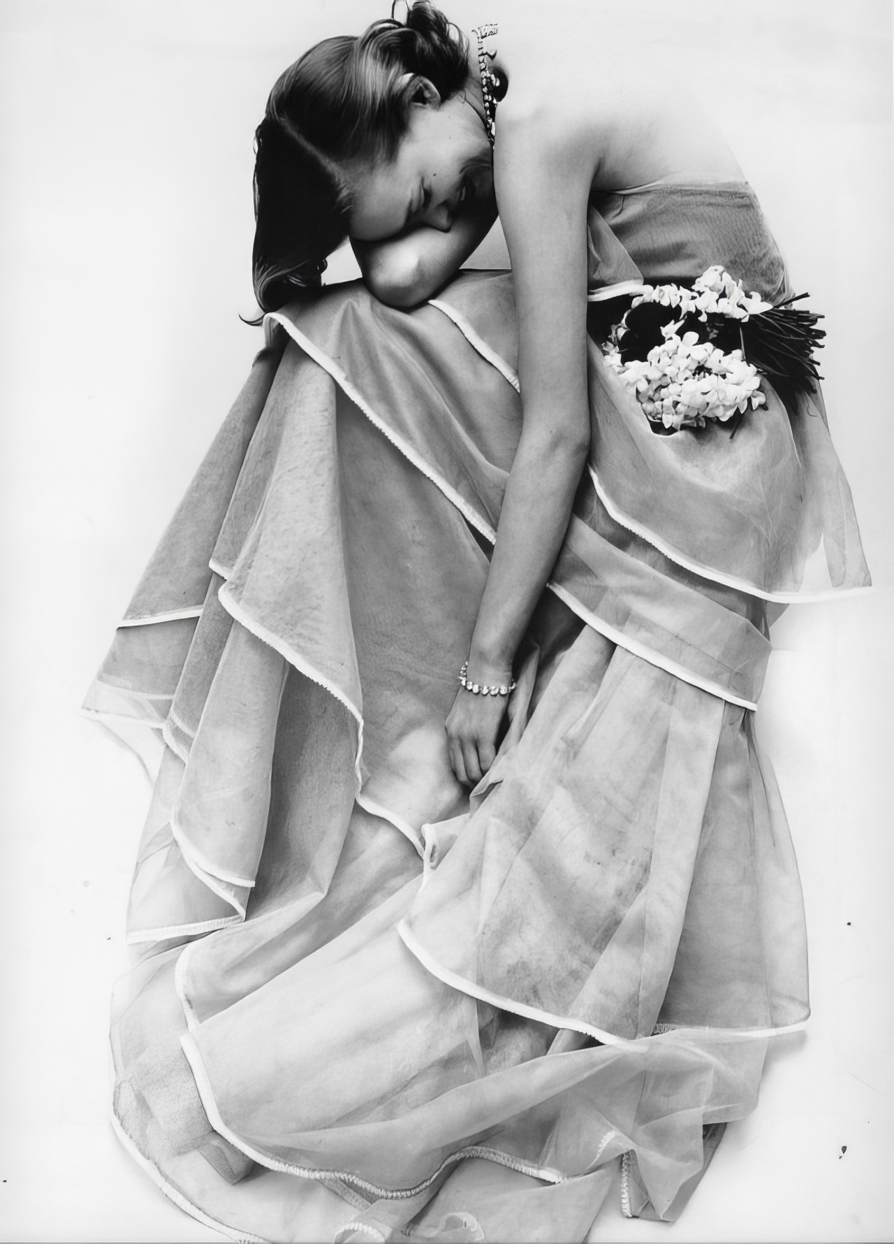 #6 Susan Abraham in a sheer organdy tiered gown, 1951.