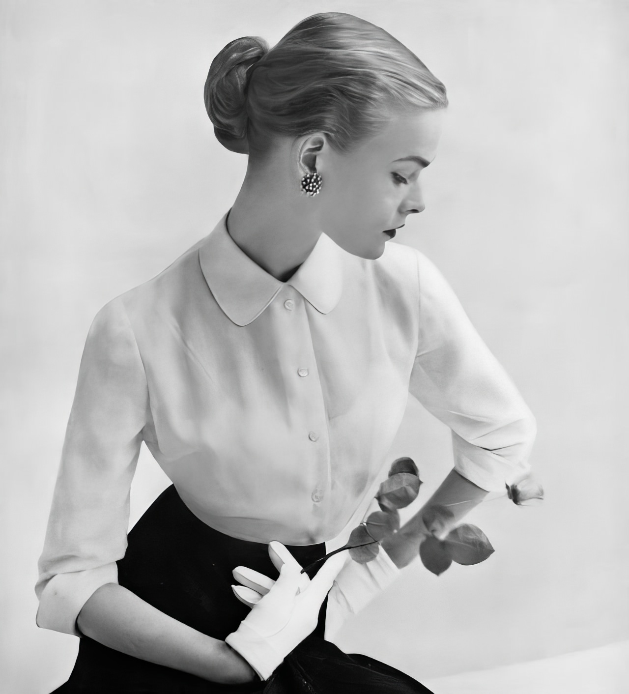 #7 Susan Abraham in a Swiss voile blouse with a stiff collar and fly-away cuffs, 1951.