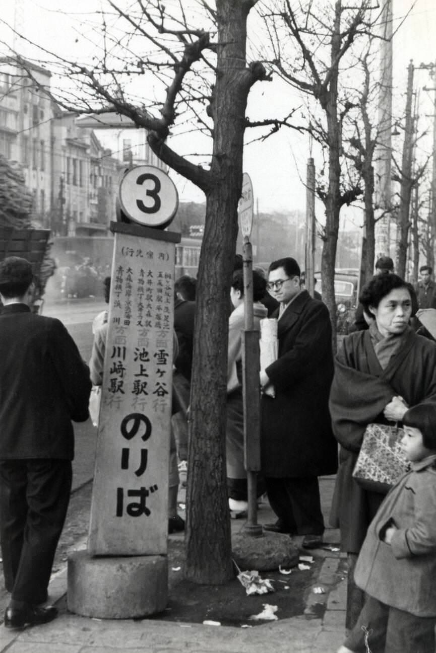 #15 A bus stop in Tokyo, 1950s.