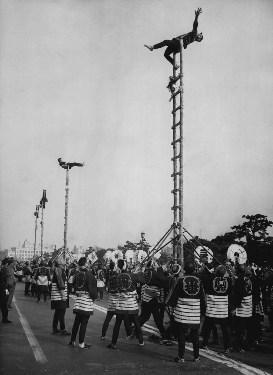 #32 Japanese firemen staged their colorful annual pageant in the grounds of the Imperial Palace in Tokyo, 1955.