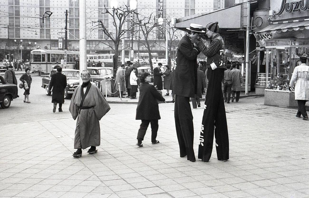 #41 Two men walking on stilts to promote a nearby business in Ikebukuro, Tokyo, 1957.