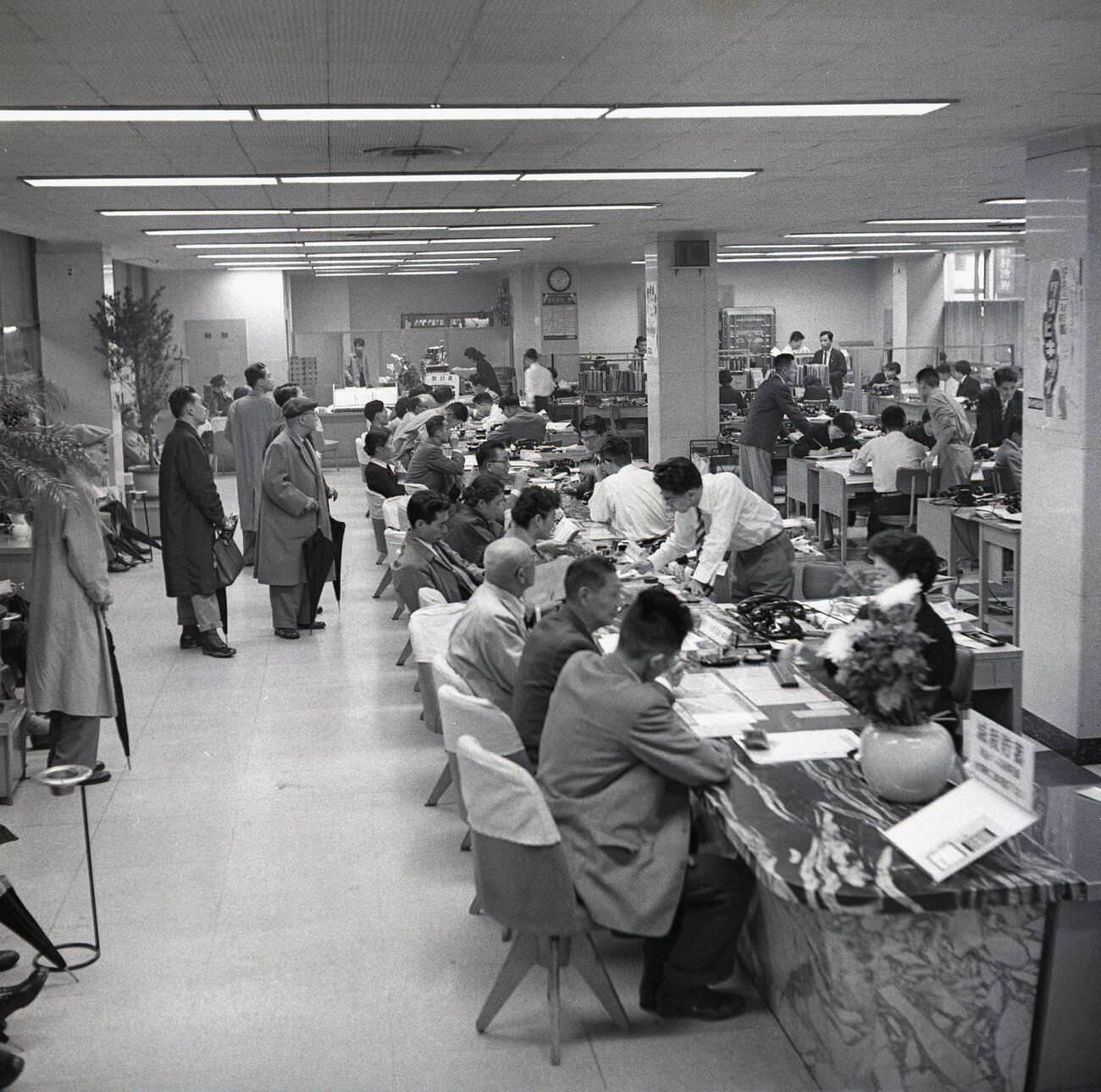 #71 Customers inside a banking hall in Tokyo, 1950s.