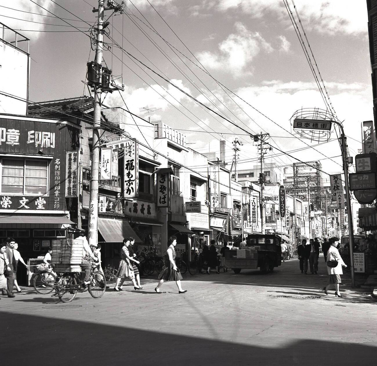 #72 A street in the old town district of Tokyo, 1950s.