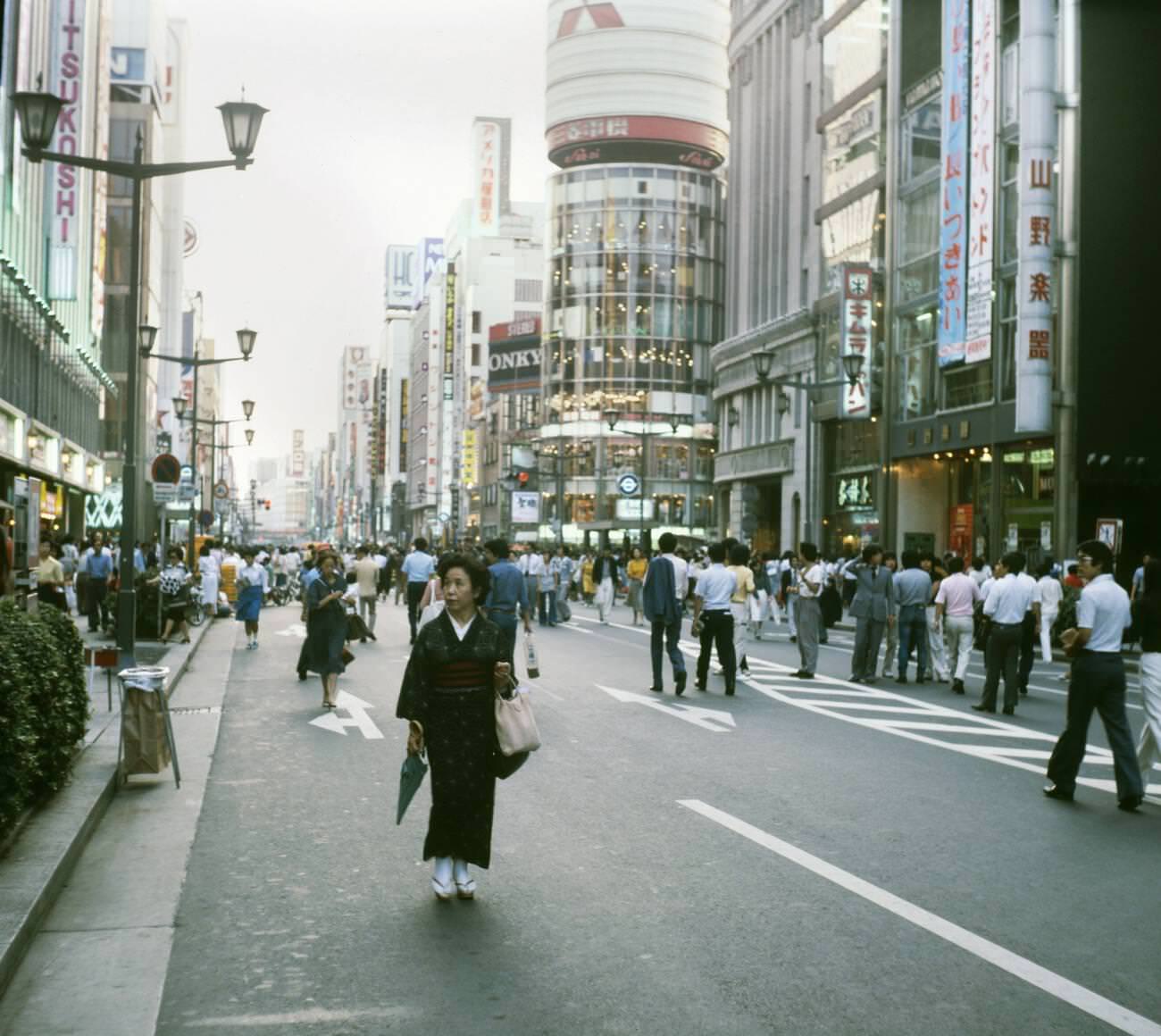 #68 Woman in traditional clothes walks down the street. Tokyo, 1978.