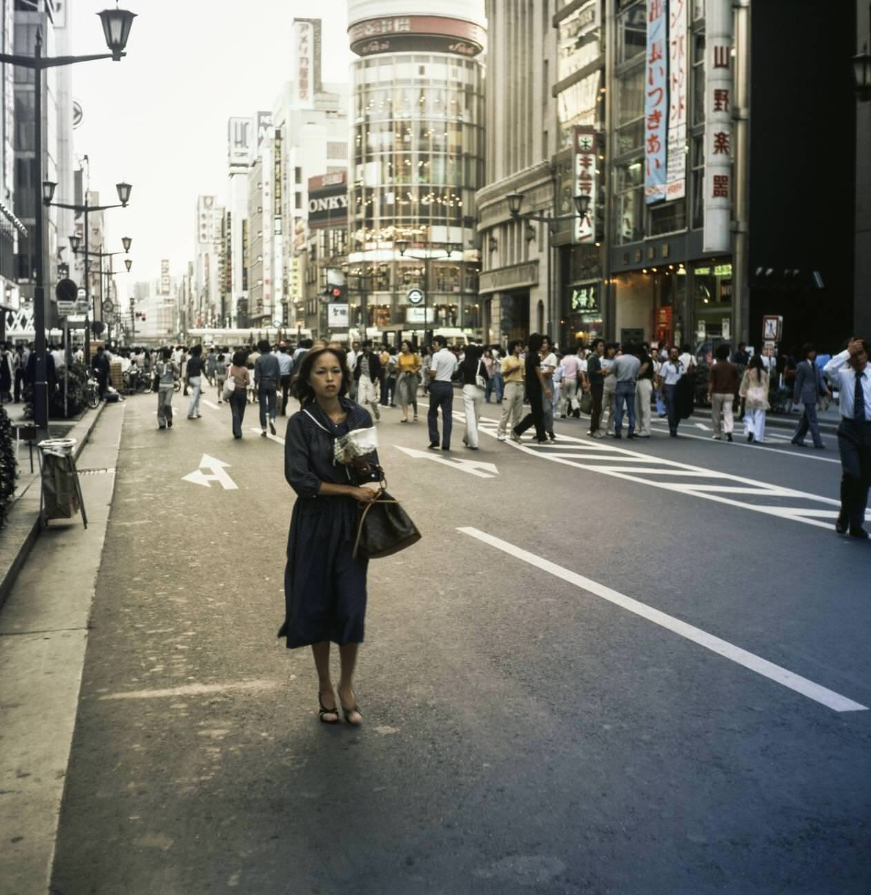 #15 Woman walks down the street. Tokyo, 1978.