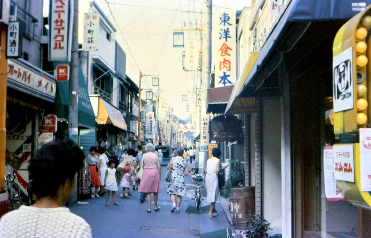 #90 Shoppers at the Ginza Shopping Center in Tokyo, 1976.