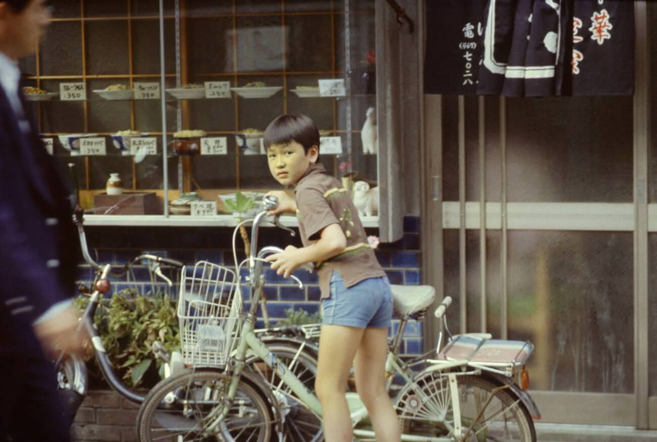 #109 Child with a bicycle, Tokyo, 1970s.