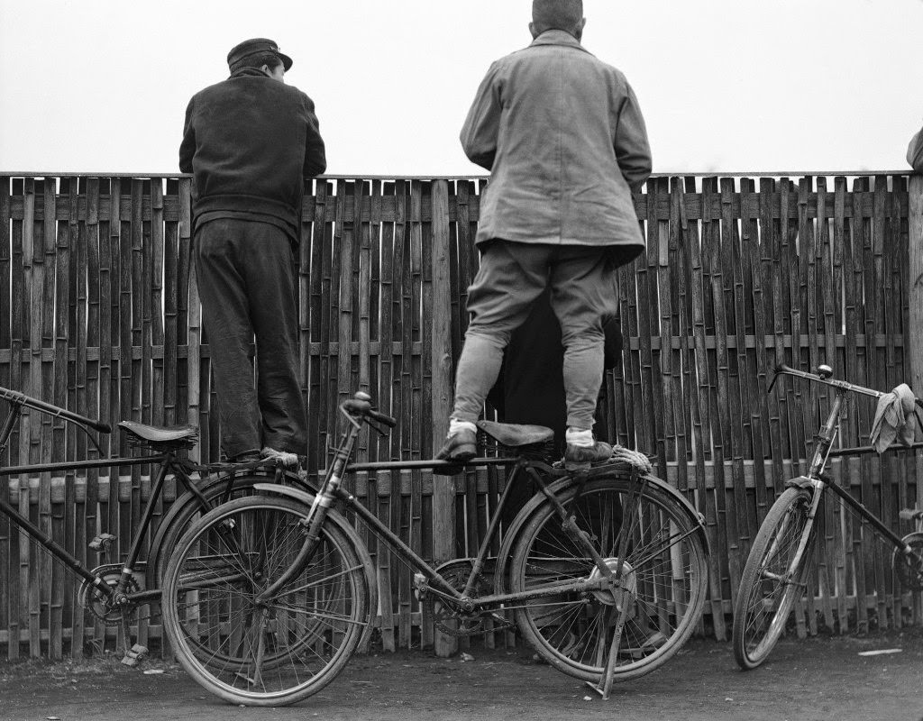 #81 These fans are watching a pre-game practice session of ball players in Tokyo, 1949.
