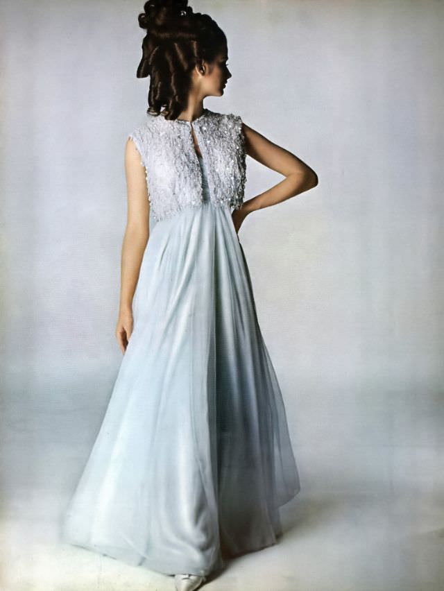 #26 Veronica Hamel in a misty blue chiffon gown, 1965.