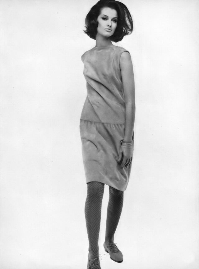 #5 Veronica Hamel in a pale apple-green suede skimmer, 1964.