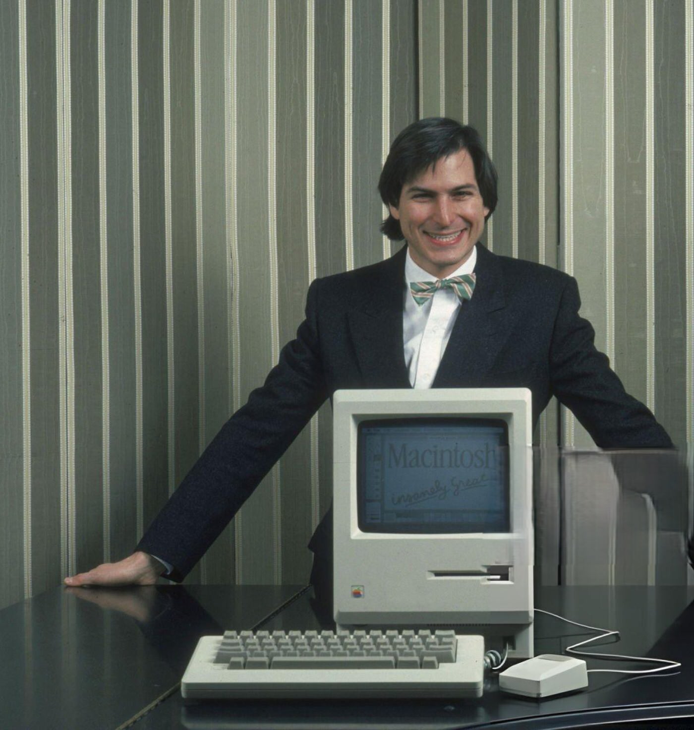 #26 Steve Jobs with a Macintosh computer in New York City, 1984.