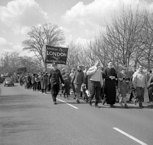#31 Left to right, Anthony Greenwood, Labour MP for Rossdale; Canon John Collins, the CND’s chairman; Jacquetta Hawkes, wife of author J.B Priestley and Professor R. Calder, the science journalist, during the march, 1963.