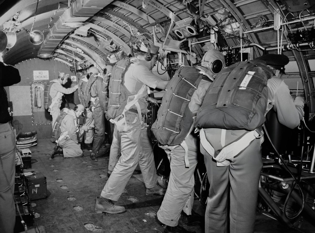 #14 Eight photographers with their cameras in a demonstration in a converted C-54 aircraft, at Roswell Army Air Field in Roswell, New Mexico, 1946.