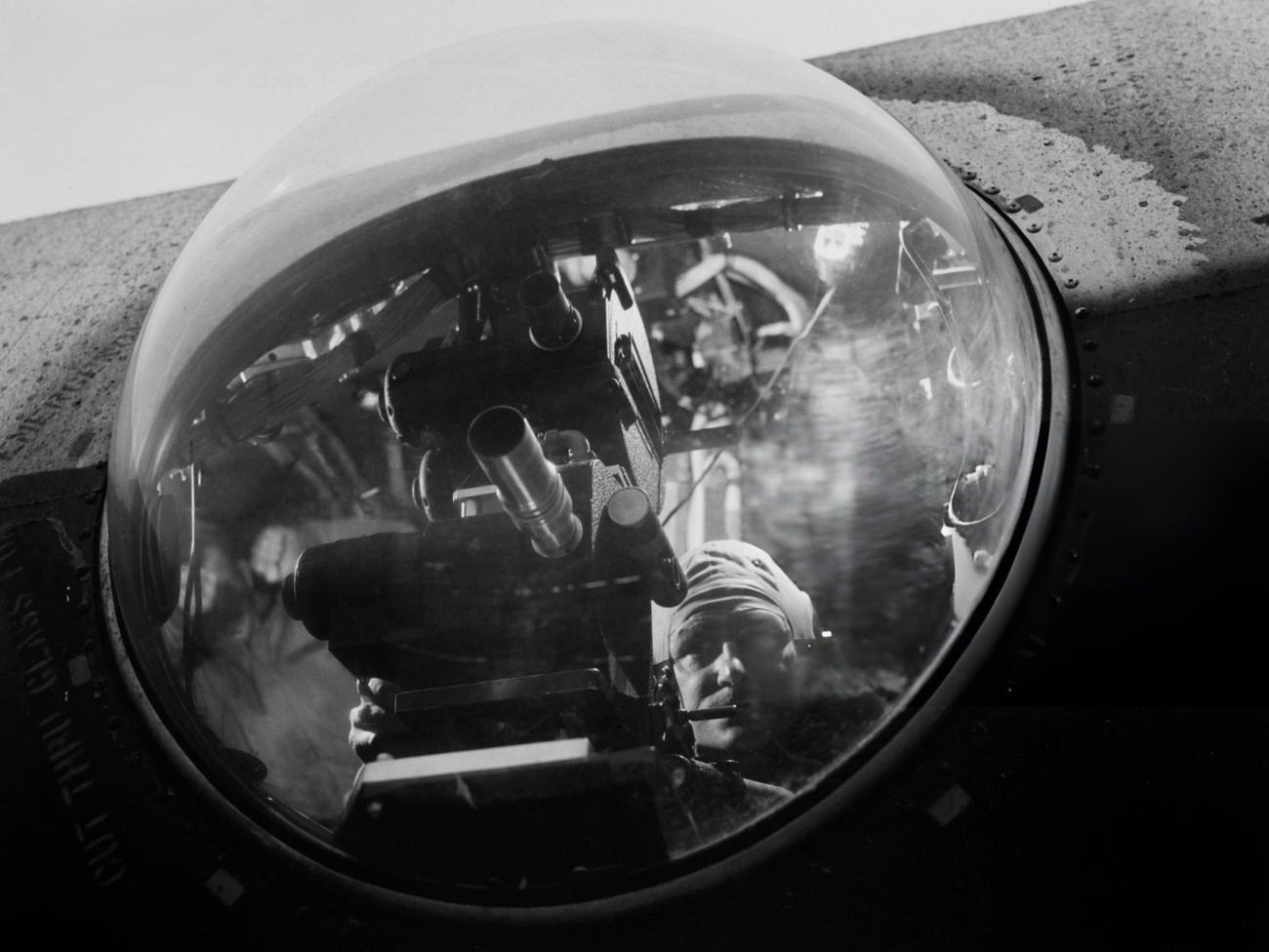 #15 American Army photographer Charles T Forsythe, protected by the blister as he aims his dual high-speed camera during a Joint Army-Navy Task Force demonstration in a B-29 Bomber, at Roswell Army Air Field in Roswell, New Mexico, 1946.