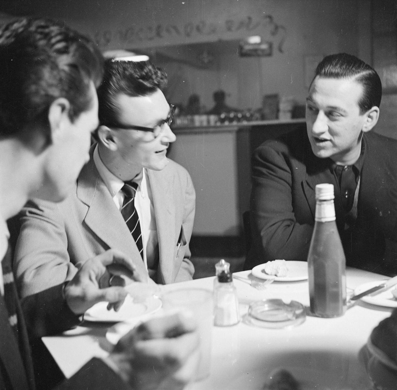 Tony Crombie and Derek Humble at a table in the Harmony Inn, by Nigel Henderson, 1954